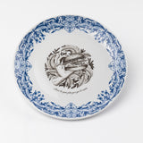 blue and white plate with design